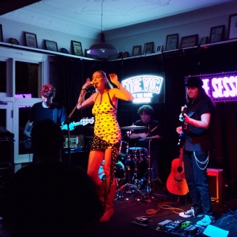 Gia Darcy, The Vic On The Park, Marrickville, with Gia Darcy front and centre with her backing band on a small stage in a pub